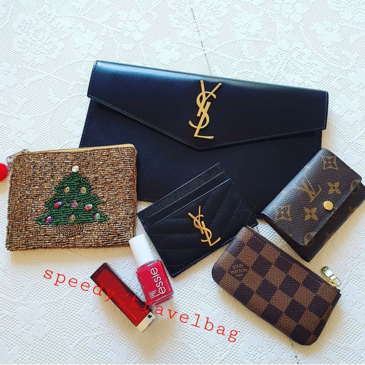 YSL ptown_新品手拿包-黑光滑皮金釦