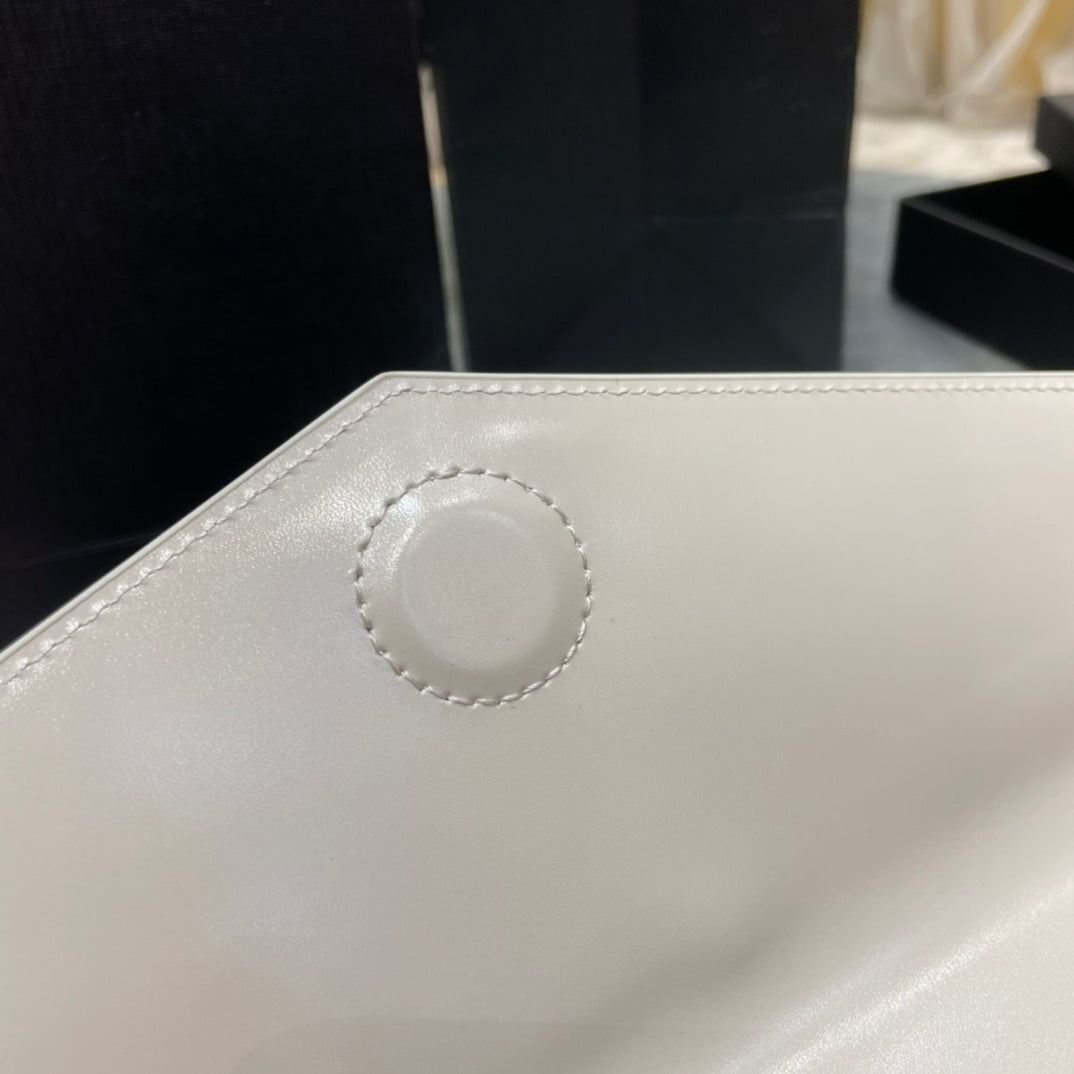 YSL ptown_新品手拿包-白光滑皮金釦