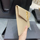 YSL ptown_新品手拿包-杏色魚子醬皮金釦
